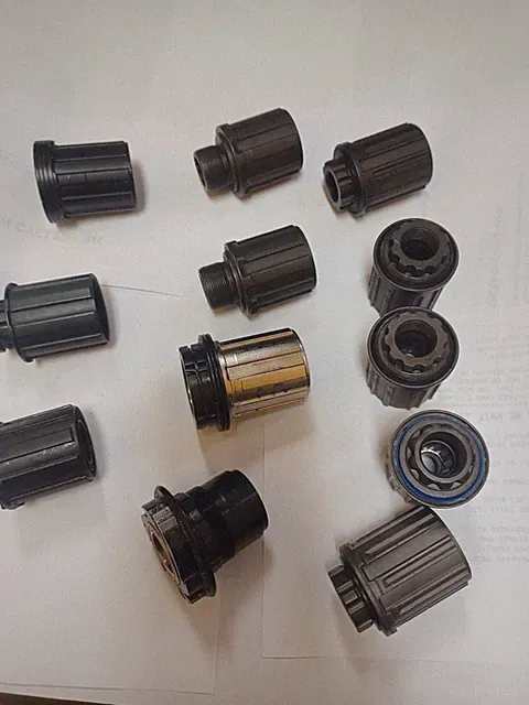 GROUP OF 12 ASSORTED BICYCLE FREEHUB BODIES NEW AND USED SEE DESCRIPTION